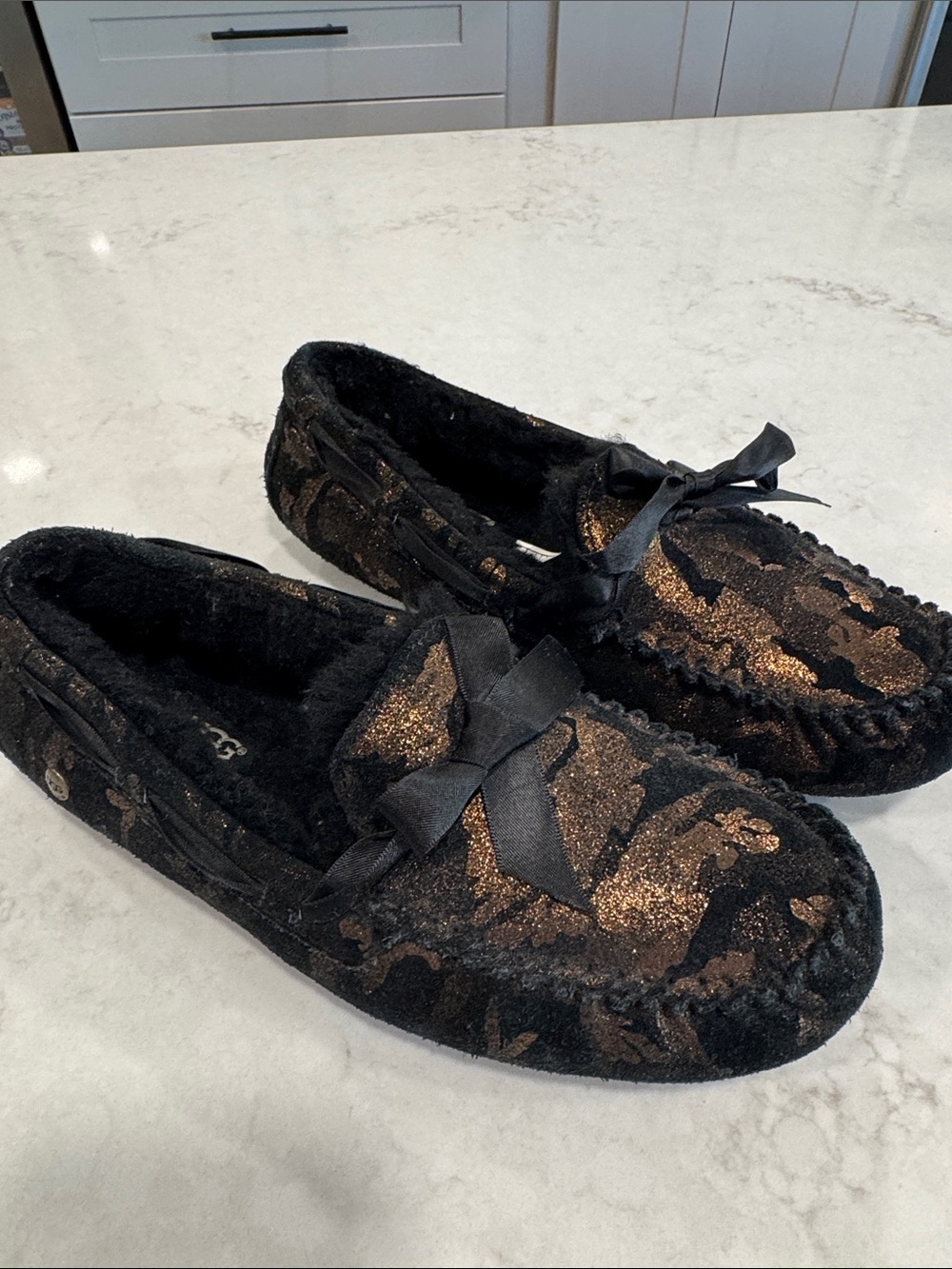 UGG Women's Black with Gold Metallic Accent Moccasin Slippers